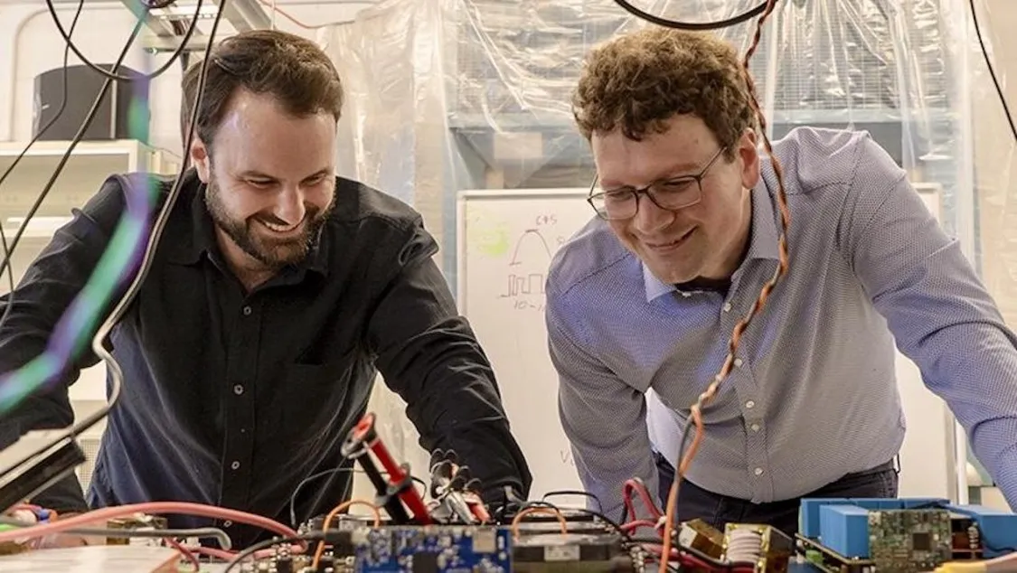 Founder and CEO of Tau Motors Wesley Pennington (left) with Associate Professor of Electrical Engineering Matthias Preindl. Photo Credit: Jane Nisselson